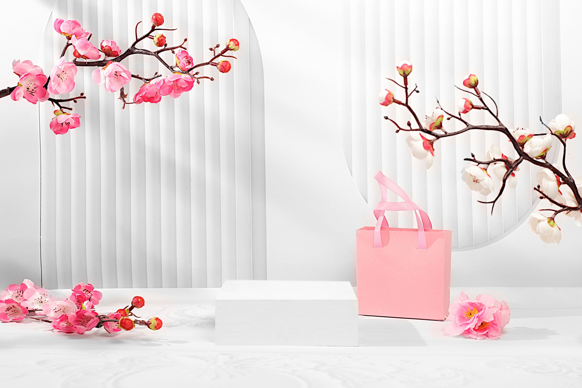 Premium elegant podium with blooming sakura and gift box,wedding concept,mother's day,sales,birthday,minimal abstract background for cosmetic products presentation,design template,podium on pedestal,